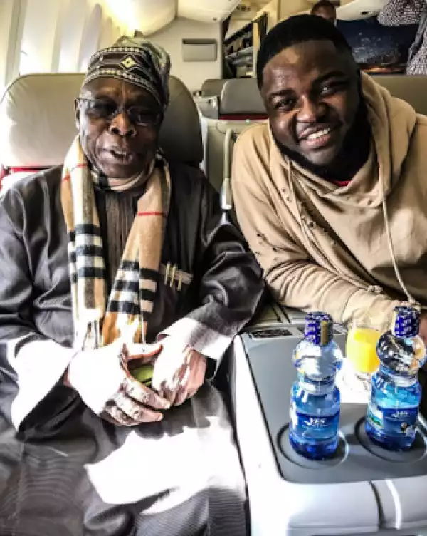 Singer Skales Pictured With Obasanjo In A Plane